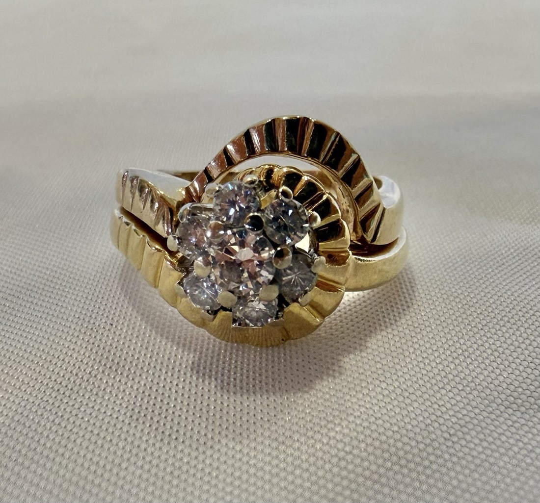 Diamond Ring in 14k Yellow Gold Size 5 with Seven Stones: Diamond Ring in 14k Yellow Gold Size 5 with Seven Stones This is a 14k yellow gold diamond ring featuring seven diamonds. The ring is a size 5 and is fully signed and hallmarked. It showcases detailed