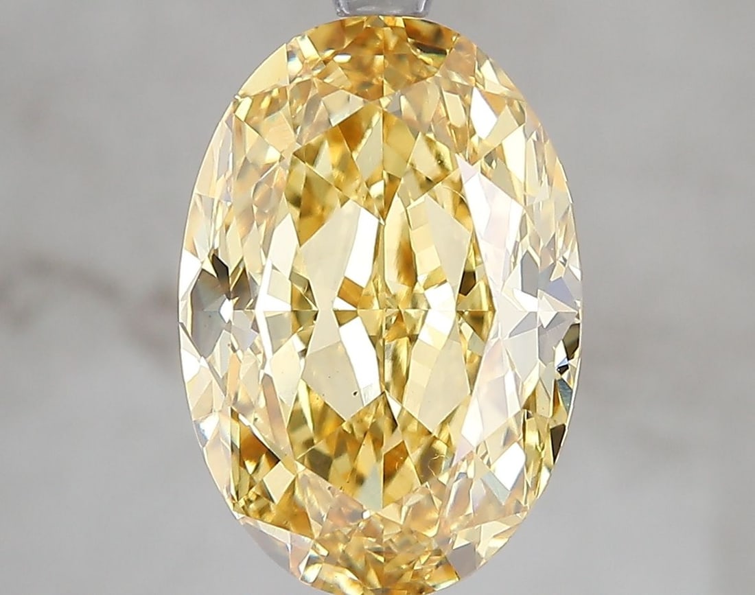 Loose Diamond - OVAL 5.07ct Fancy Vivid Yellow VS2: Loose Diamond - OVAL 5.07ct Fancy Vivid Yellow VS2 Source: This is a real non-mined Diamond that has been grown in a lab Shape: OVAL Carats: 5.07 Color: Fancy Vivid Yellow Certification: IGI Video: