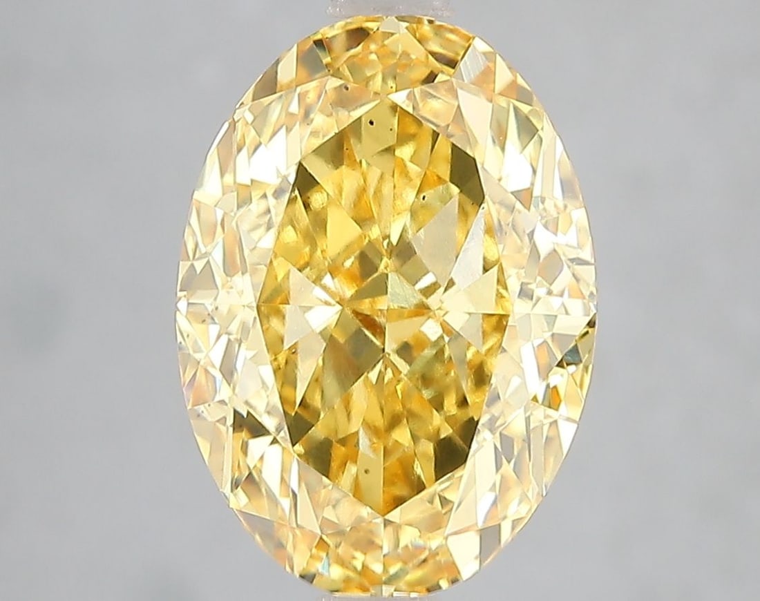 Loose Diamond - OVAL 5.03ct Fancy Vivid Yellow VS2: Loose Diamond - OVAL 5.03ct Fancy Vivid Yellow VS2 Source: This is a real non-mined Diamond that has been grown in a lab Shape: OVAL Carats: 5.03 Color: Fancy Vivid Yellow Certification: IGI Video: