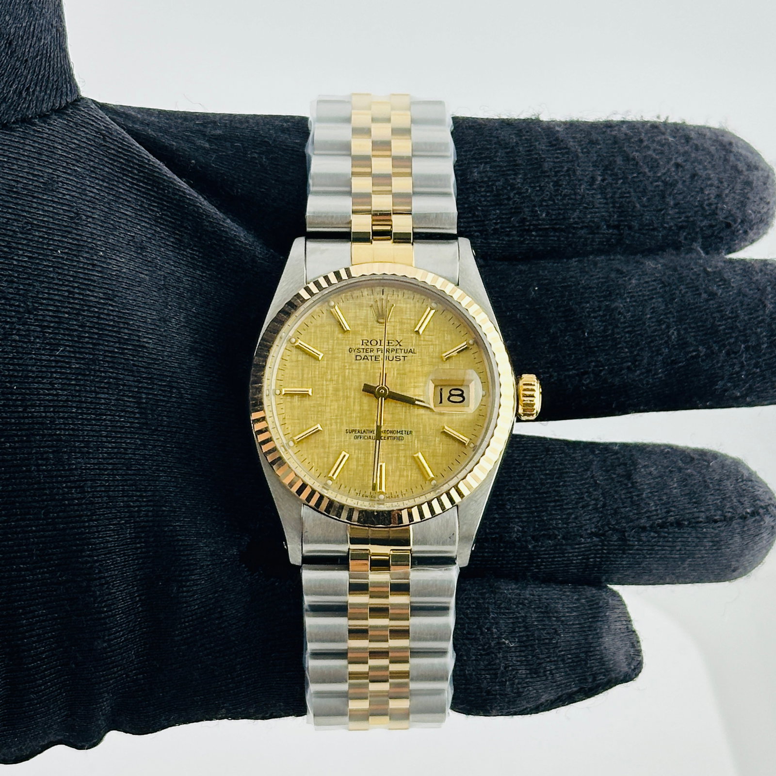 Rolex Datejust 16013 Champagne Linen Dial Aftermarket Jubilee Bracelet: Rolex Datejust 16013 Champagne Linen Dial Aftermarket Jubilee Bracelet This Rolex Datejust watch features a champagne linen stick dial and a fluted bezel, offering a refined and classic look. It is eq