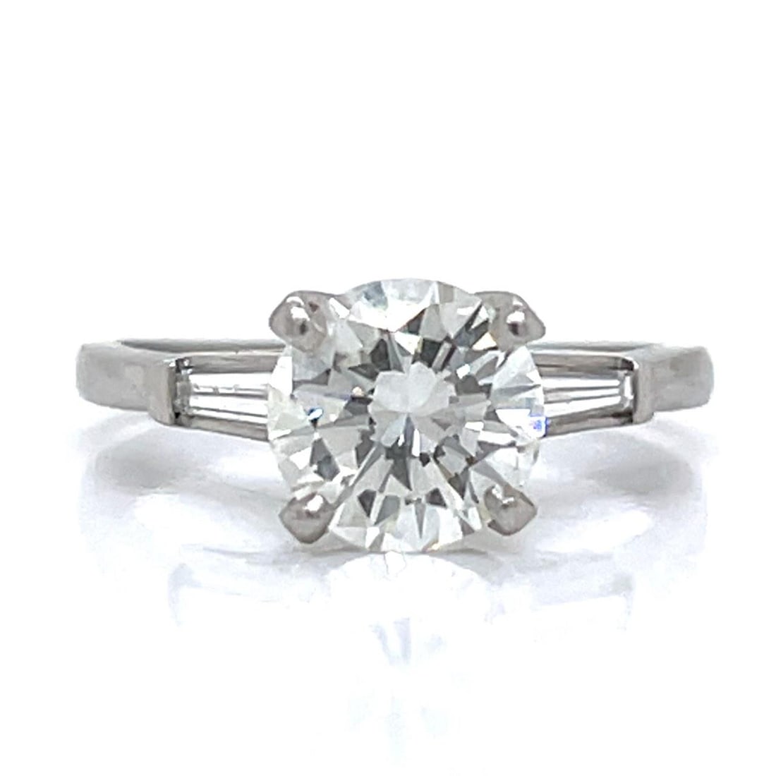 1950s Platinum Diamond Engagement Ring 1.60 Ct Center Gem: 1950s Platinum Diamond Engagement Ring 1.60 Ct Center Gem This exquisite 1950's engagement ring is crafted in platinum and features a stunning central diamond weighing approximately 1.60 ct. The diamo