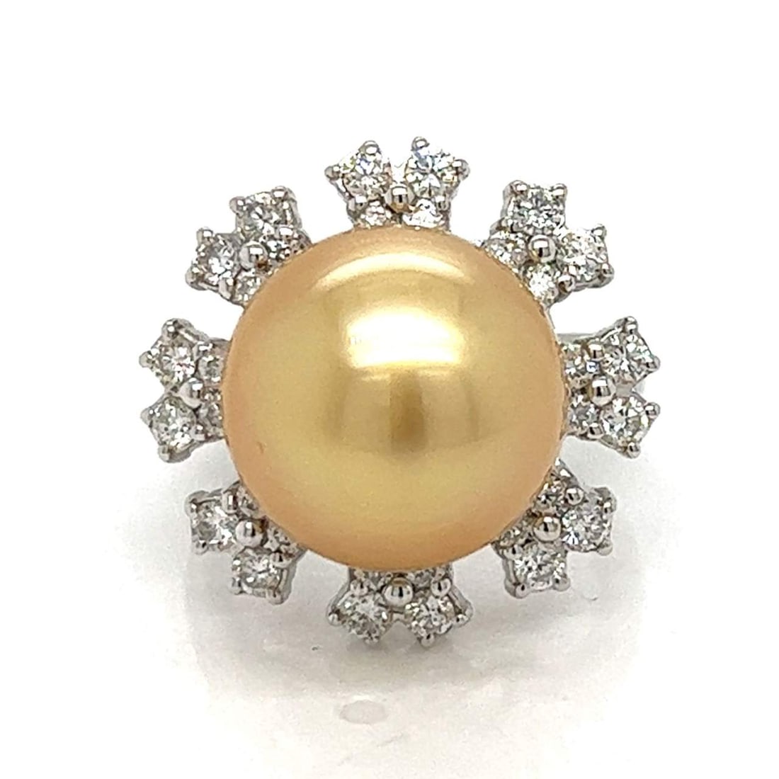 18K White Gold South Sea Pearl Diamond Ring 1.00 Ct: 18K White Gold South Sea Pearl Diamond Ring 1.00 Ct This exquisite 18K White Gold ring features a stunning 13.12mm South Sea pearl at its center, elegantly surrounded by 32 sparkling diamonds totaling