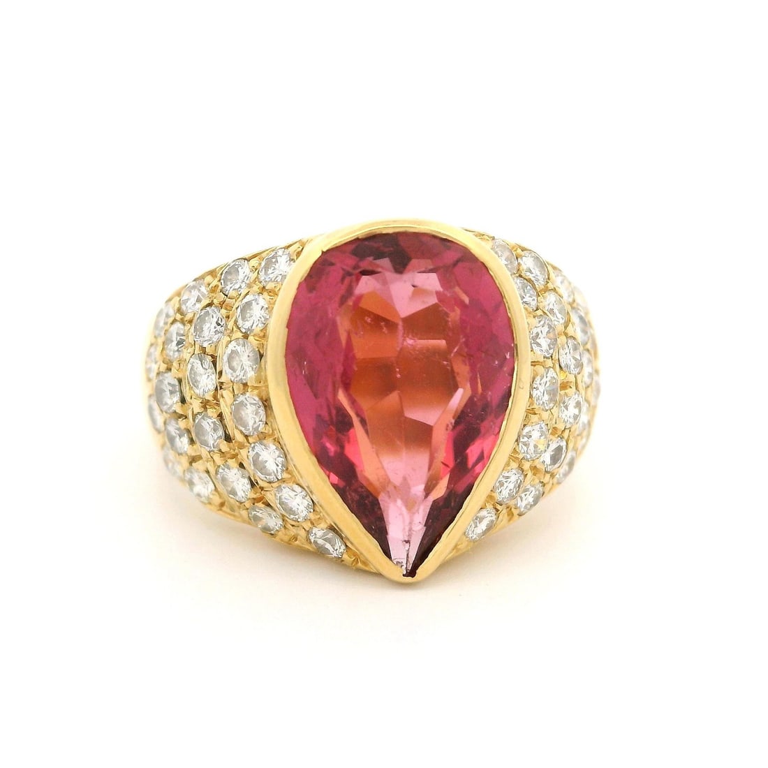 Vintage 18k Yellow Gold 3.5ctw Pear Tourmaline Diamond Ring: Vintage 18k Yellow Gold 3.5ctw Pear Tourmaline Diamond Ring This exquisite vintage statement ring features a stunning 3.5ctw pear cut tourmaline at its center, beautifully complemented by a pave setti