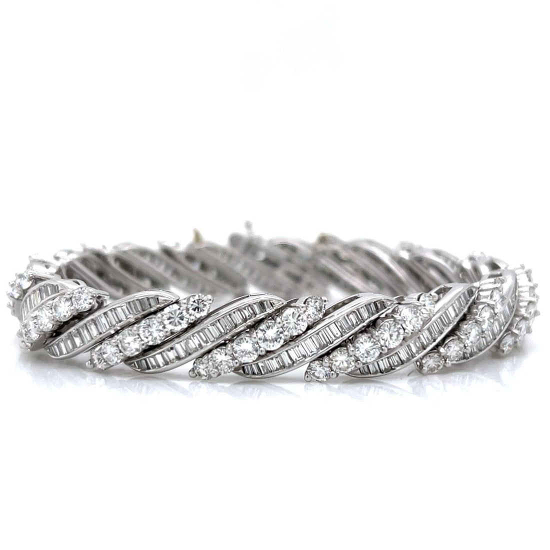 15.80 Ct. Platinum Diamond Bracelet with 196 Baguette Diamonds: 15.80 Ct. Platinum Diamond Bracelet with 196 Baguette Diamonds This exquisite Platinum Diamond Bracelet features a remarkable total diamond weight of 15.80 carats. It is elegantly designed with 196 ba