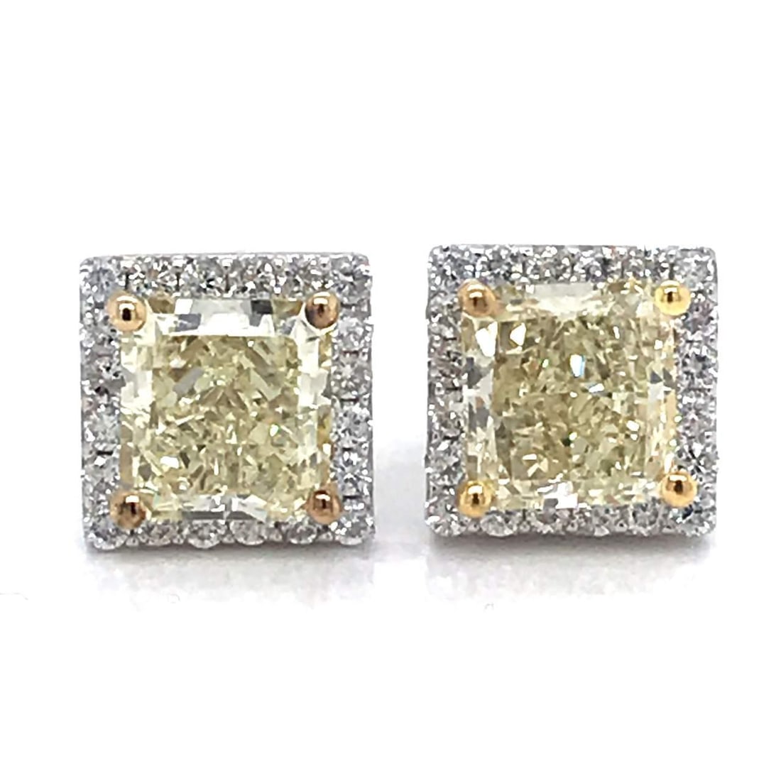 3.22 Ct Fancy Light Yellow VVS Diamond Earrings 14K White Gold: 3.22 Ct Fancy Light Yellow VVS Diamond Earrings 14K White Gold Enhance your elegance with these stunning 3.22 Ct Fancy Light Yellow Diamond Earrings. Featuring two exquisite princess cut diamonds with