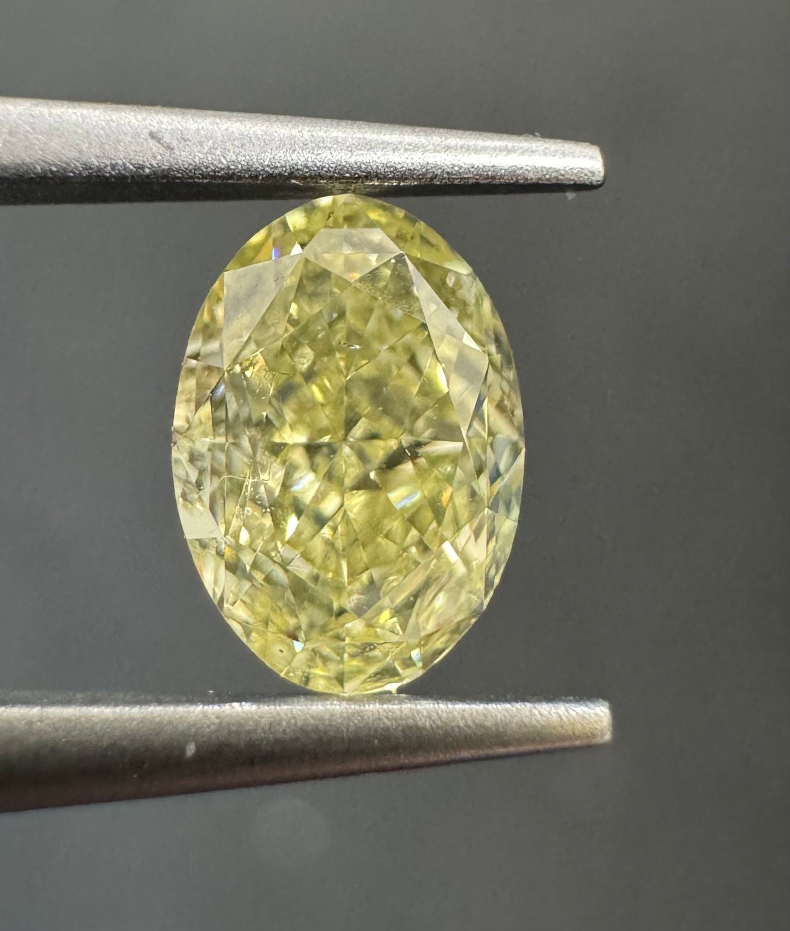 Loose Diamond - OVAL 0.72ct Fancy Light Yellow SI1: Loose Diamond - OVAL 0.72ct Fancy Light Yellow SI1 Source: Natural Shape: OVAL Carats: 0.72 Color: Fancy Light Yellow Certification: GIA The Diamond Depot Guarantee: All items in this auction are guar