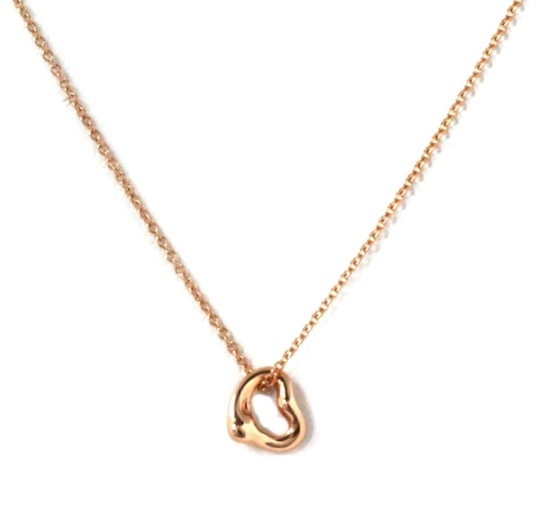 Tiffany Elsa Peretti Open Heart 18k Rose Gold Pendant Necklace: Tiffany Elsa Peretti Open Heart 18k Rose Gold Pendant Necklace This authentic Tiffany & Co. Elsa Peretti Mini Open Heart pendant necklace is crafted in 18k rose gold and features the iconic open heart