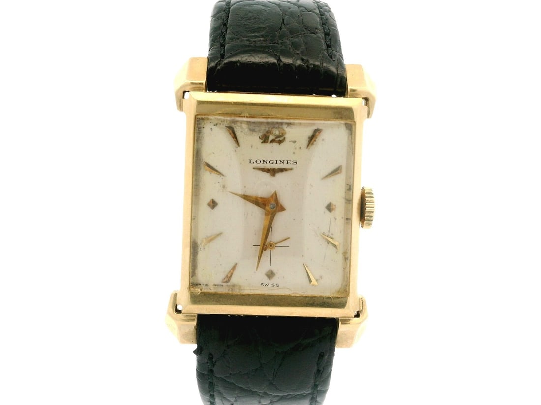 Vintage Longines 14k Yellow Gold Mechanical Rectangle Watch with Leather Strap: Vintage Longines 14k Yellow Gold Mechanical Rectangle Watch with Leather Strap This vintage Longines wristwatch features a stunning 14k yellow gold case with a rectangular shape, measuring 22mm in wid