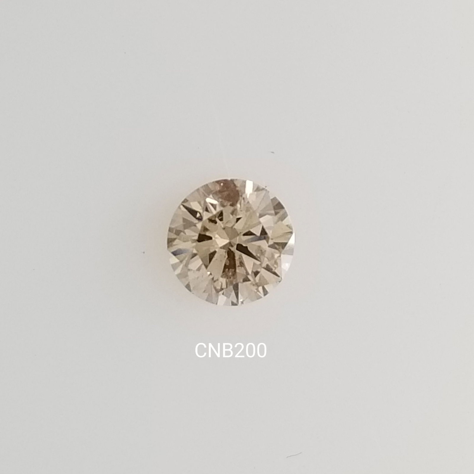 Loose Diamond - ROUND 0.67ct Fancy Light Brown SI2: Loose Diamond - ROUND 0.67ct Fancy Light Brown SI2 Source: Natural Shape: ROUND Carats: 0.67 Color: Fancy Light Brown Certification: NONE The Diamond Depot Guarantee: All items in this auction are gua