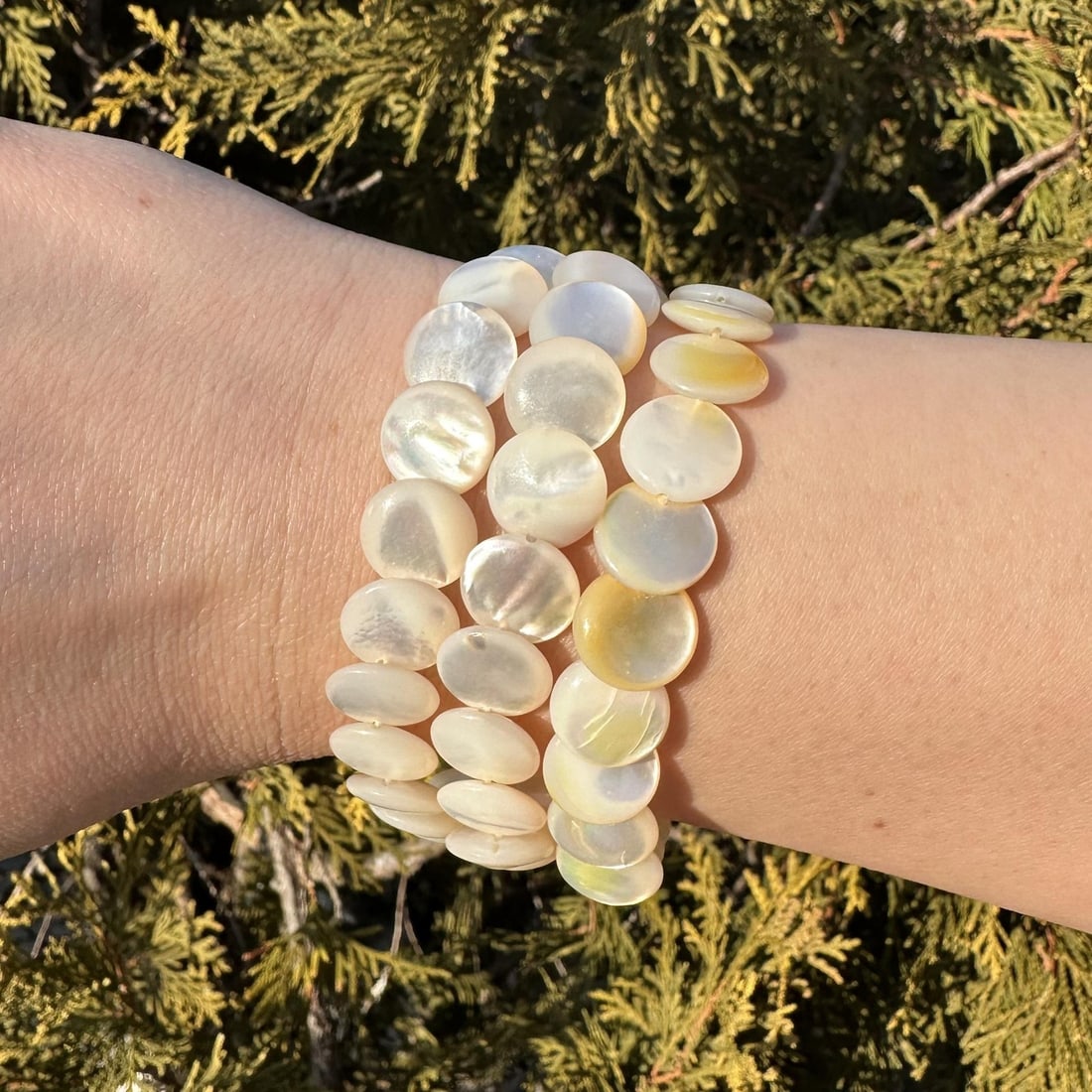 Three Strand Pearl Bracelet with 14k Yellow Gold Grooved Clasp Vintage: Three Strand Pearl Bracelet with 14k Yellow Gold Grooved Clasp Vintage This vintage bracelet features three strands of genuine cultured coin-shaped pearls in white, each measuring approximately 11.9-1