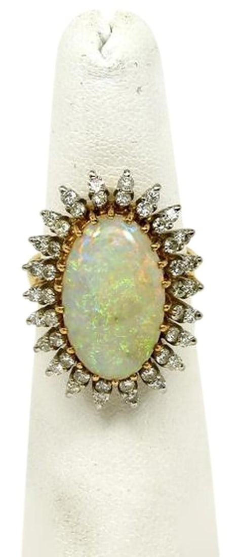 14k Yellow Gold Fire Opal Diamond Cocktail Ring Size 6.25: 14k Yellow Gold Fire Opal Diamond Cocktail Ring Size 6.25 This exquisite estate cocktail ring features a large oval fire opal at its center, beautifully surrounded by a multi-pointed oval border adorn