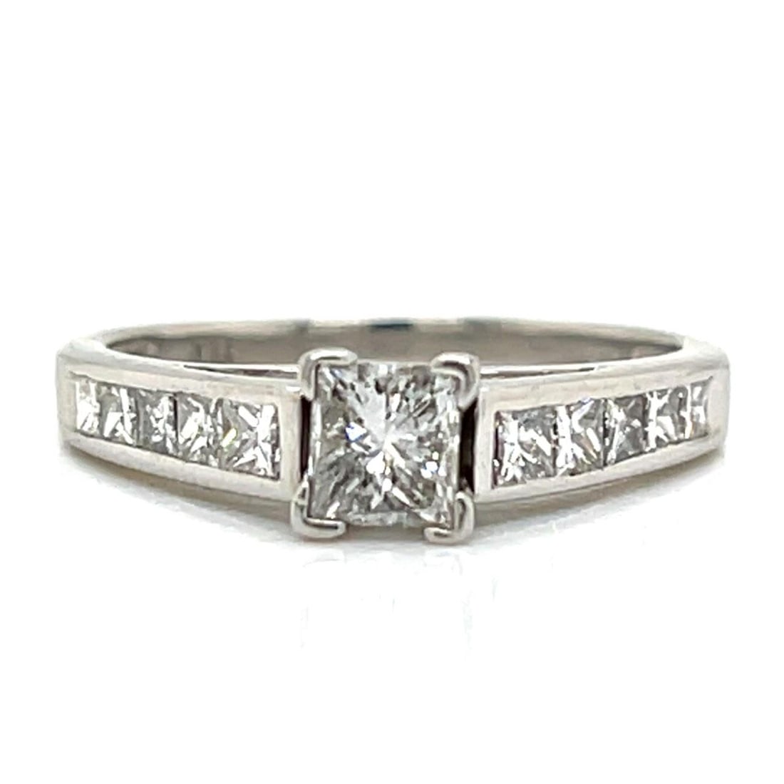 Princess Cut Platinum Diamond Ring with 1.35 Carat Total Gem Weight: Princess Cut Platinum Diamond Ring with 1.35 Carat Total Gem Weight This platinum ring features a total diamond weight of approximately 1.35 carats. The centerpiece is a princess-cut diamond of about 