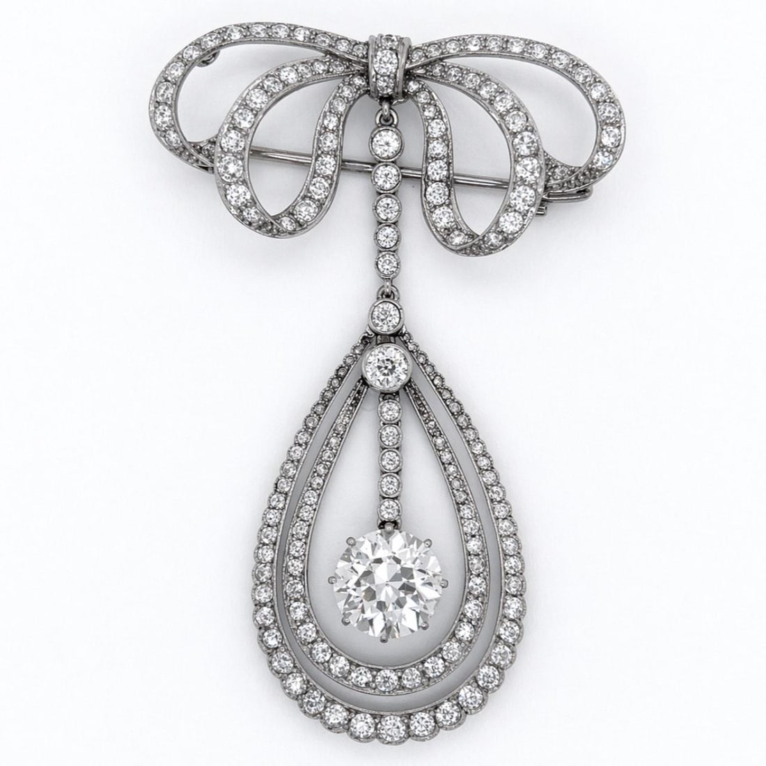 Platinum Edwardian Brooch with European Cut and Accent Diamonds 2.5 Inch: Platinum Edwardian Brooch with European Cut and Accent Diamonds 2.5 Inch This Edwardian brooch is crafted in platinum and showcases an approximately 3.20 carat European-cut diamond with I-J color and 