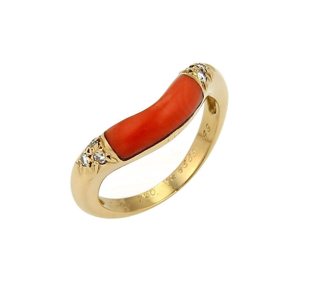 Cartier 18k Yellow Gold Coral Diamond Band Ring Size 5: Cartier 18k Yellow Gold Coral Diamond Band Ring Size 5 This Cartier stack band ring is crafted in 18k yellow gold and features a vibrant natural coral inlay accented by approximately 0.06 carats of di