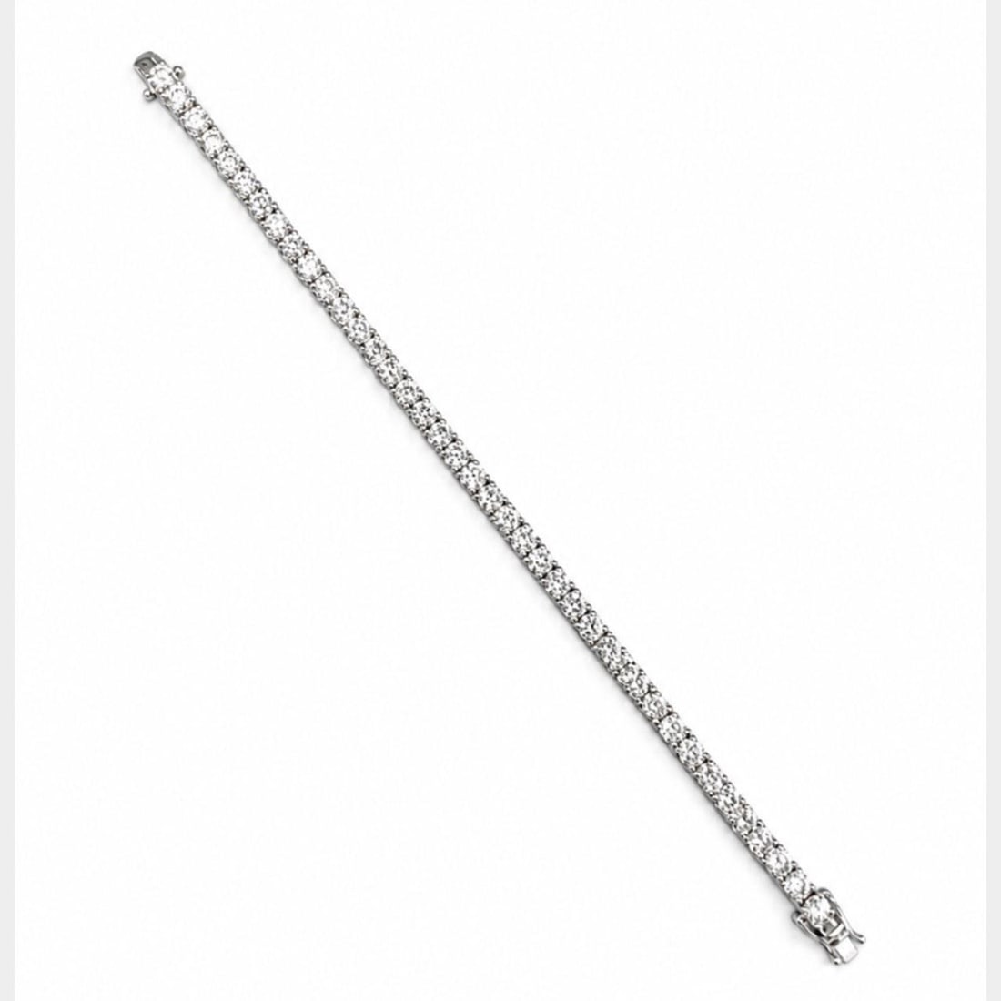 Diamond Tennis Bracelet 14K White Gold 13.10 Ct 40 Stones 7 Inch: Diamond Tennis Bracelet 14K White Gold 13.10 Ct 40 Stones 7 Inch This 14K white gold tennis bracelet features 40 diamonds with a total weight of approximately 13.10 carats. The diamonds are graded F-H