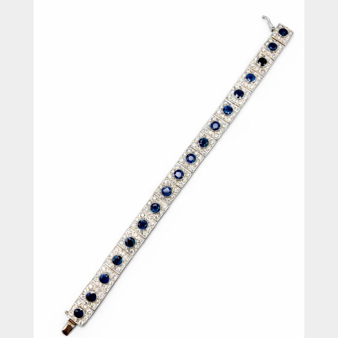 7.5 Inch Platinum Bracelet with 18 Sapphires and 144 Diamonds: 7.5 Inch Platinum Bracelet with 18 Sapphires and 144 Diamonds This platinum bracelet features 18 sapphires with an approximate total weight of 10.00 carats and 144 diamonds with an approximate total w