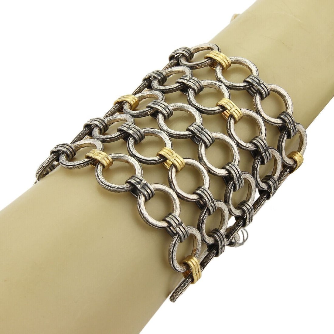 Gurhan Hoopla sterling silver bracelet with 24k gold overlay: Gurhan Hoopla sterling silver bracelet with 24k gold overlay This Gurhan Hoopla bracelet features oversized circular ring links crafted from sterling silver with a radiant 24k gold overlay. The bold m