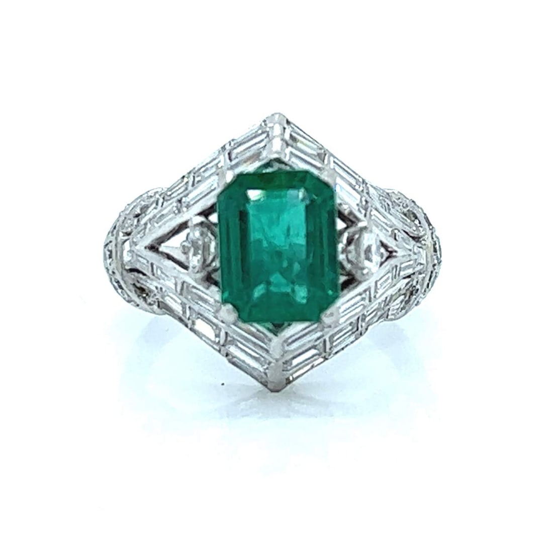 Art Deco Platinum Ring with 2.60 Ct Emerald and 54 Diamonds: Art Deco Platinum Ring with 2.60 Ct Emerald and 54 Diamonds Discover this exquisite Art Deco Platinum Emerald and Diamond Ring, showcasing a stunning approximately 2.60 carat emerald at its center. Th