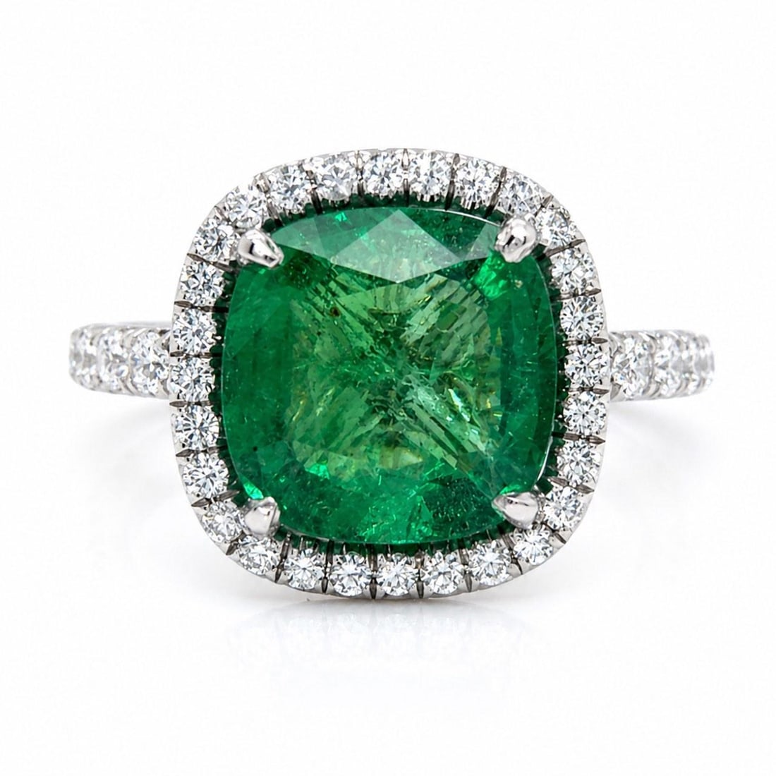3.50 Carat Emerald and Diamond Platinum Ring Size 7: 3.50 Carat Emerald and Diamond Platinum Ring Size 7 This platinum ring features an approximately 3.50 carat emerald as the centerpiece, accented by approximately 1.10 carats of diamonds with F-G color