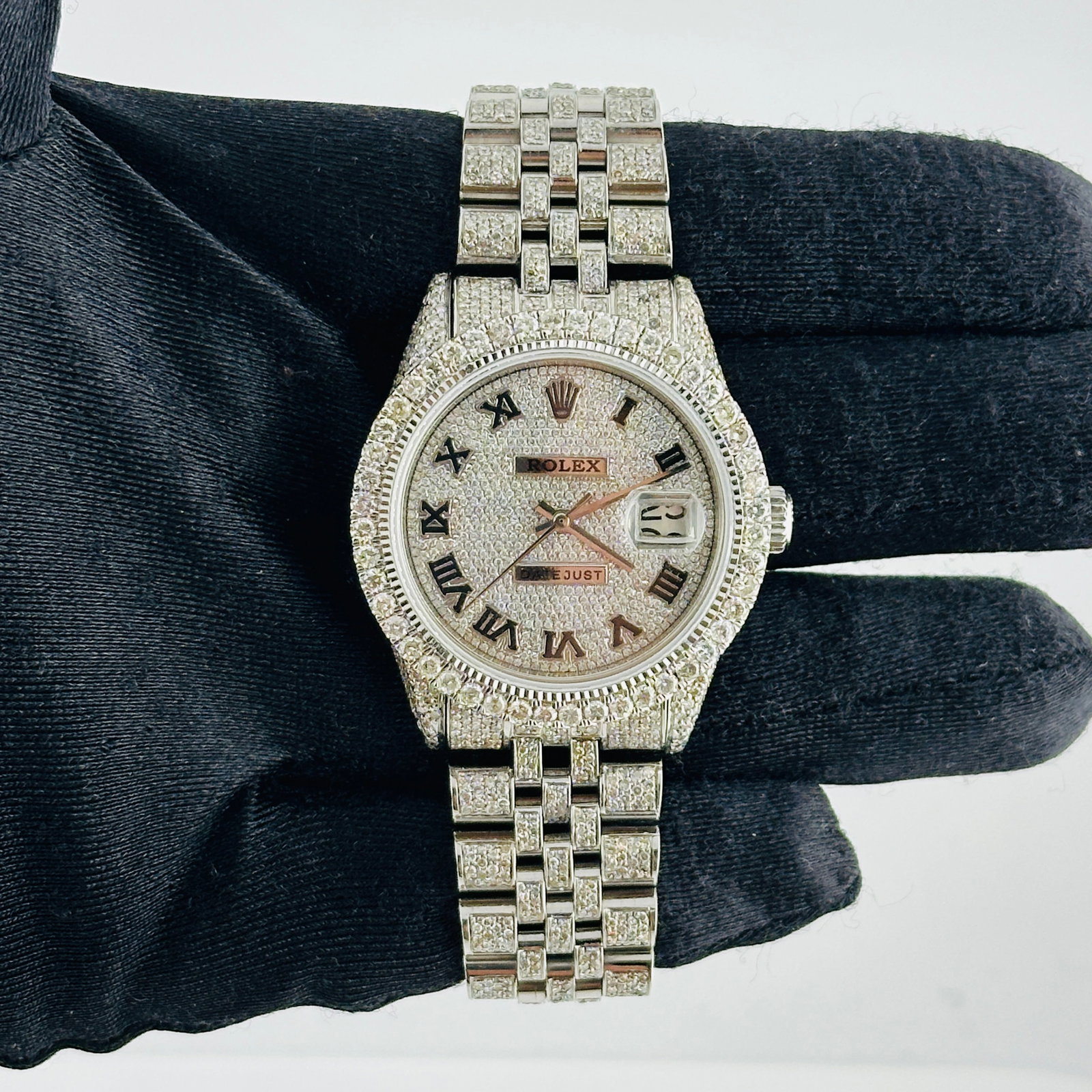 Datejust Ref 1603 Men's Watch with Diamond Roman Dial and Aftermarket Jubilee Bracelet: Datejust Ref 1603 Men's Watch with Diamond Roman Dial and Aftermarket Jubilee Bracelet This Rolex Datejust men's watch features a diamond Roman dial and a diamond prong bezel. It is equipped with an a