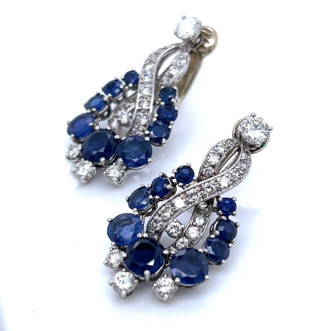 Platinum Art Deco Drop Earrings with Sapphires and Diamonds: Platinum Art Deco Drop Earrings with Sapphires and Diamonds Art Deco platinum earrings featuring 18 sapphires with an approximate total weight of 5.30 carats and 50 diamonds totaling approximately 2.6