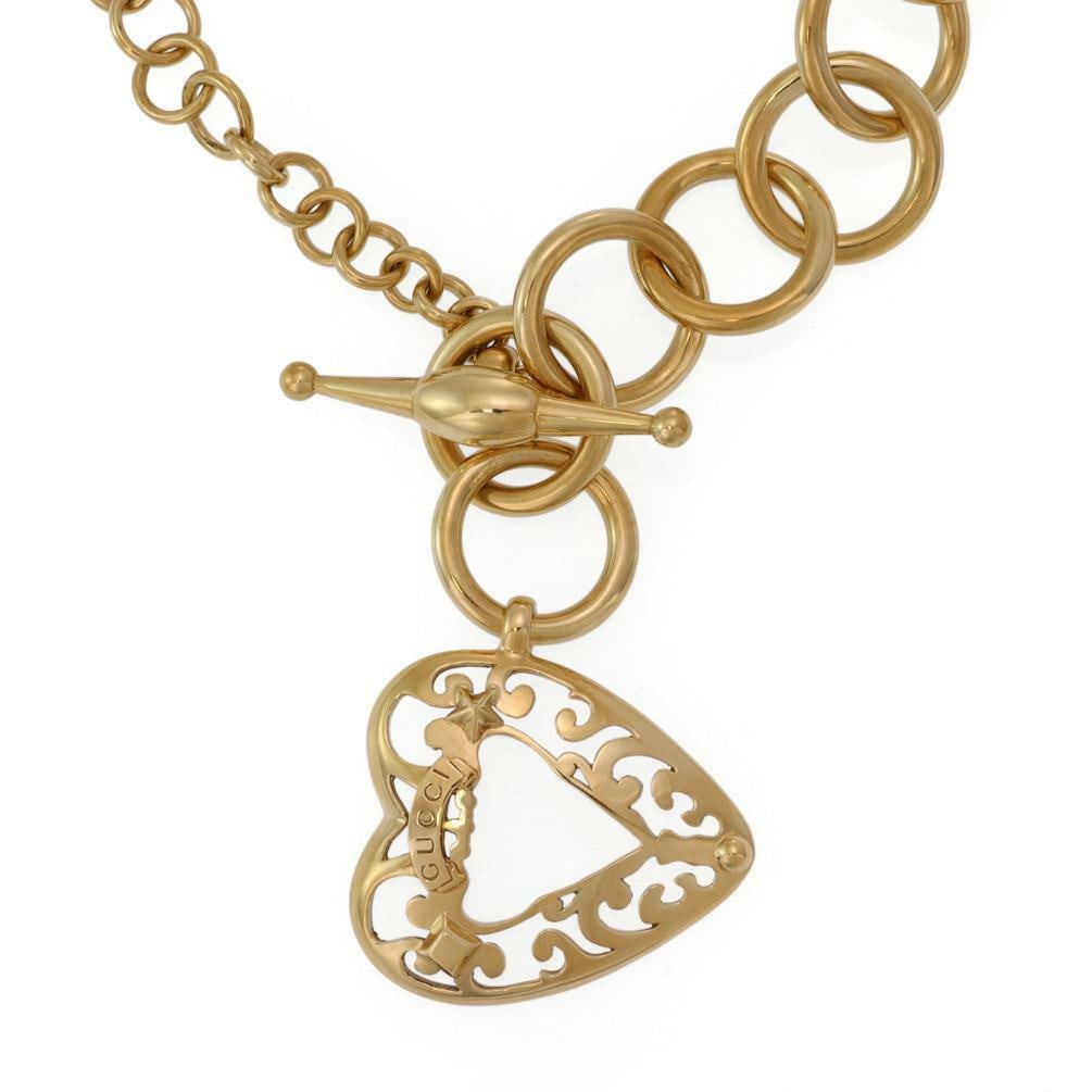 Gucci 18k Yellow Gold Heart Toggle Necklace 23.5" 102g: Gucci 18k Yellow Gold Heart Toggle Necklace 23.5" 102g Enhance your jewelry collection with this stunning Gucci necklace, expertly crafted from 18k yellow gold. The necklace features a series of gradu
