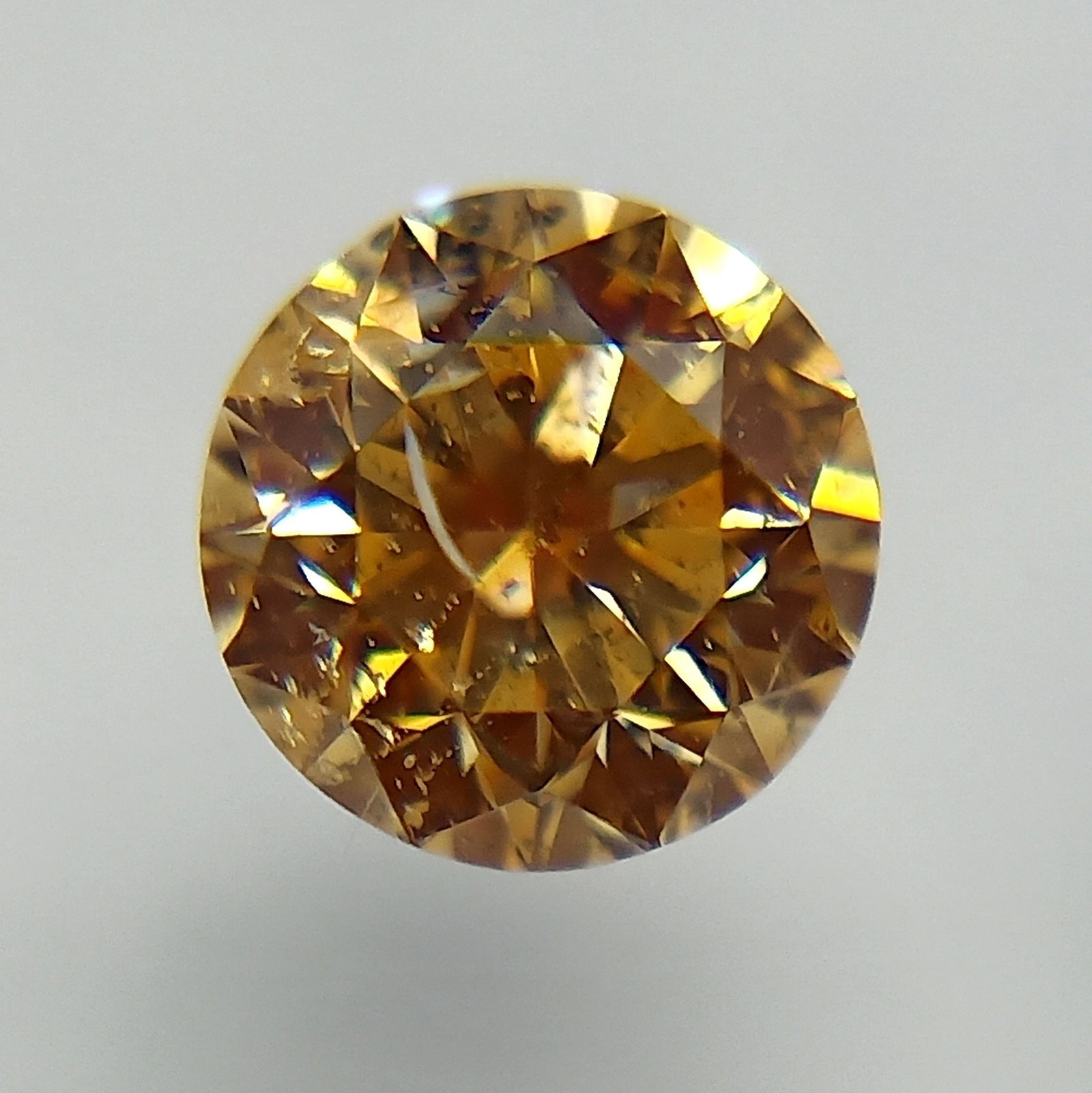 Loose Diamond - ROUND 0.3ct Fancy Orangey Yellow: Loose Diamond - ROUND 0.3ct Fancy Orangey Yellow Source: Natural Shape: ROUND Carats: 0.3 Color: Fancy Orangey Yellow Certification: GIA The Diamond Depot Guarantee: All items in this auction are guar