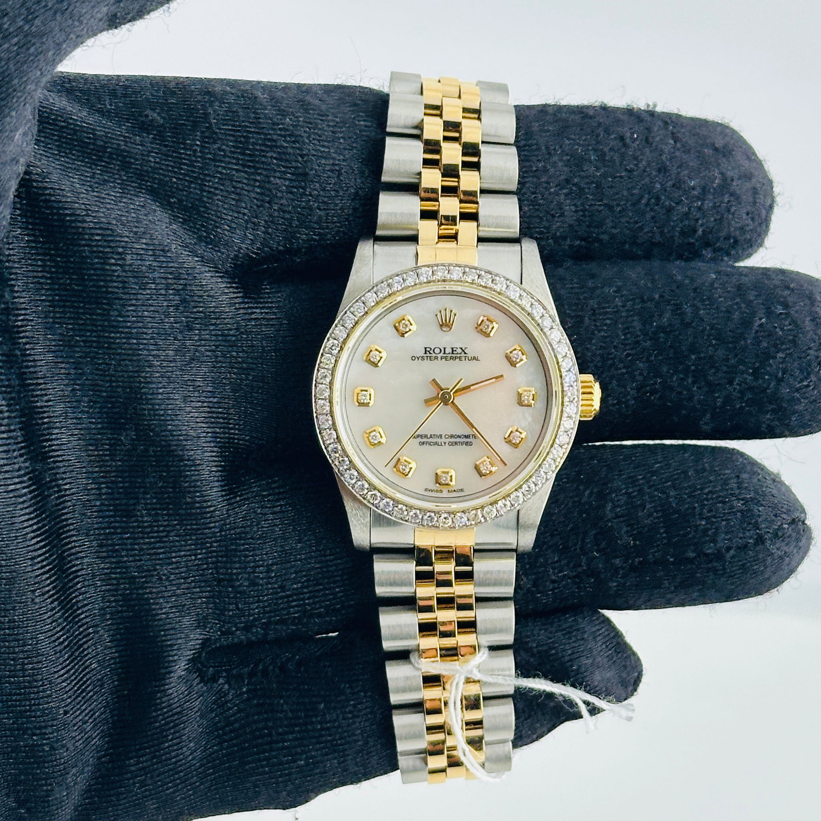 Rolex Ladies Oyster Perpetual 67513 White MOP Diamond Dial Jubilee Bracelet: Rolex Ladies Oyster Perpetual 67513 White MOP Diamond Dial Jubilee Bracelet This ladies Rolex Datejust features an after-market white mother-of-pearl dial adorned with diamond hour markers. The watch 
