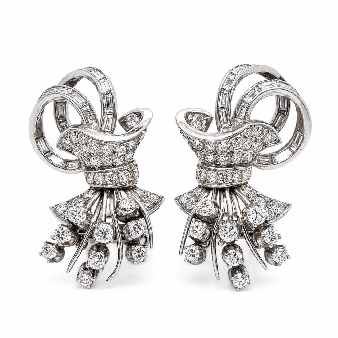 Platinum Art Deco Diamond Earrings with 3.80 Carats European and Baguette Cuts: Platinum Art Deco Diamond Earrings with 3.80 Carats European and Baguette Cuts These Art Deco platinum earrings feature a total diamond weight of approximately 3.80 carats. The pair is set with 74 Eur
