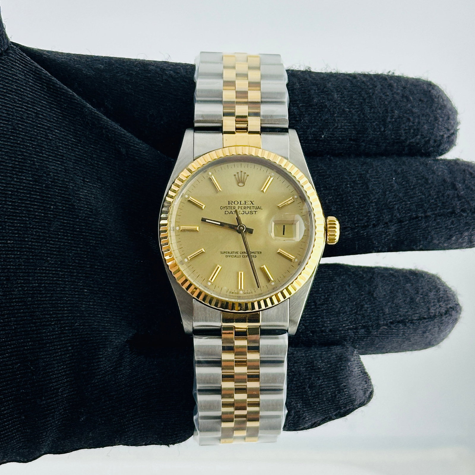 Rolex Datejust 16013 Champagne Dial Fluted Bezel Aftermarket Jubilee Bracelet: Rolex Datejust 16013 Champagne Dial Fluted Bezel Aftermarket Jubilee Bracelet This Rolex Datejust features a champagne stick dial and is paired with an aftermarket Jubilee bracelet. The watch is ident