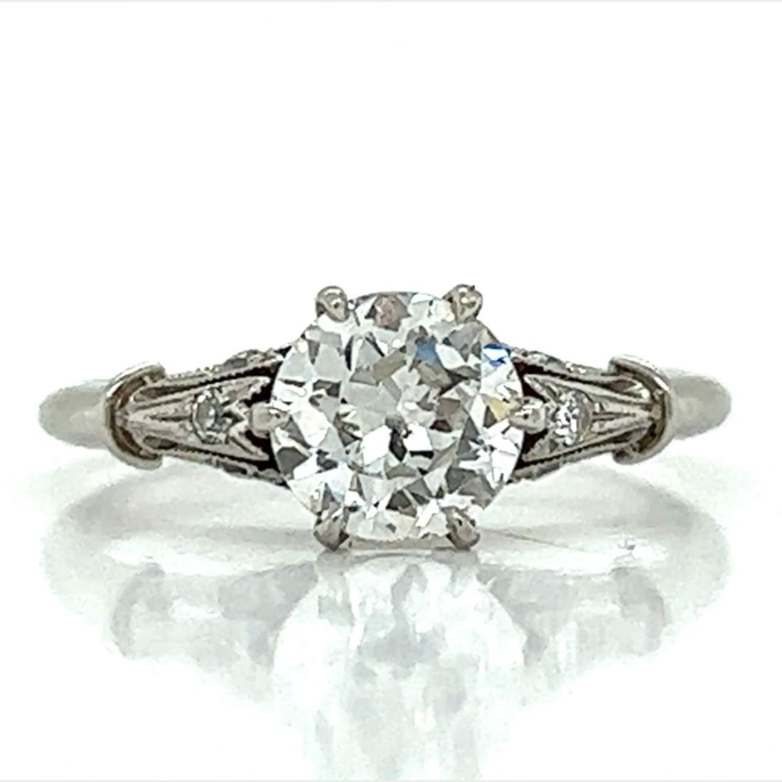 GIA Certified 1.02 Ct Diamond Engagement Ring in Platinum: GIA Certified 1.02 Ct Diamond Engagement Ring in Platinum This exquisite engagement ring features a stunning GIA Certified 1.02 Ct. round diamond, showcasing H color and SI2 clarity. The diamond is el