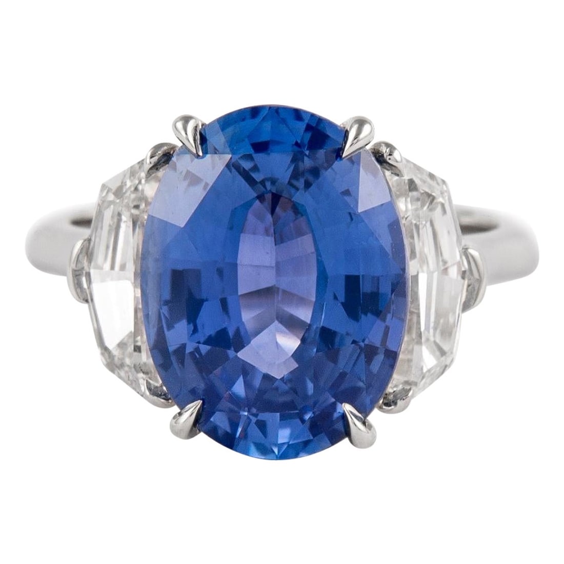 GIA 6.65ct Sapphire Diamond Platinum Ring: GIA 6.65ct Sapphire Diamond Platinum Ring This exquisite three-stone ring showcases a stunning GIA certified 6.65 ct Ceylon sapphire, complemented by two radiant epaulet cut diamonds. Crafted in plati