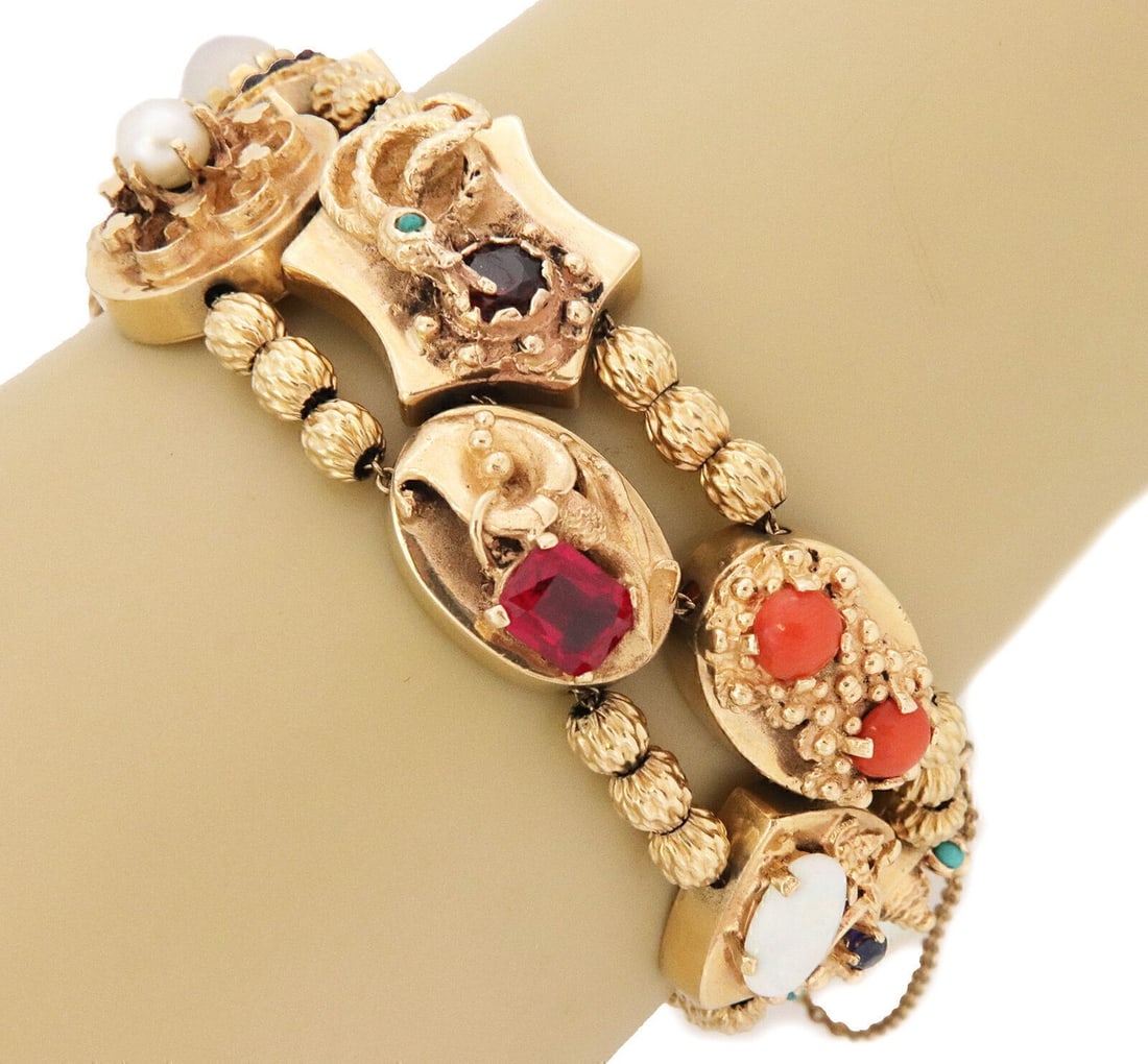 14k Yellow Gold Double Chain Charm Bracelet with Gemstone Slides: 14k Yellow Gold Double Chain Charm Bracelet with Gemstone Slides This vintage double-chain slide charm bracelet is crafted from solid 14k yellow gold and features a striking arrangement of ten large d