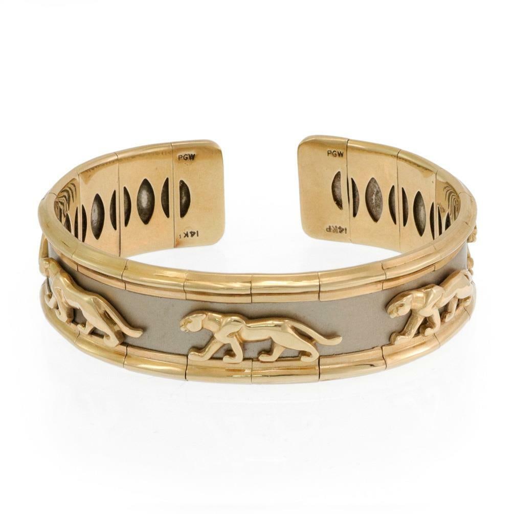 Estate 14k Two Tone Gold Panther Cuff Bangle Bracelet 17mm Wide: Estate 14k Two Tone Gold Panther Cuff Bangle Bracelet 17mm Wide This exquisite panther cuff bangle bracelet features a striking design crafted from 14k yellow and white gold. The bracelet showcases a 