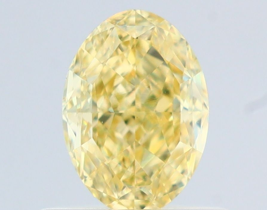 Loose Diamond - OVAL 0.7ct Fancy Yellow VS1: Loose Diamond - OVAL 0.7ct Fancy Yellow VS1 Source: Natural Shape: OVAL Carats: 0.7 Color: Fancy Yellow Certification: GIA The Diamond Depot Guarantee: All items in this auction are guaranteed to be 1