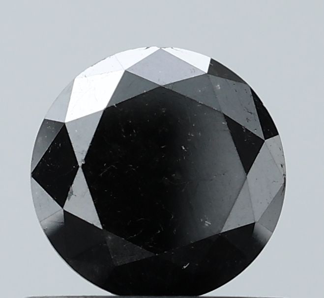 Loose Diamond - ROUND 0.94ct Fancy Black VS1: Loose Diamond - ROUND 0.94ct Fancy Black VS1 Source: Natural Shape: ROUND Carats: 0.94 Color: Fancy Black Certification: NONE Video: