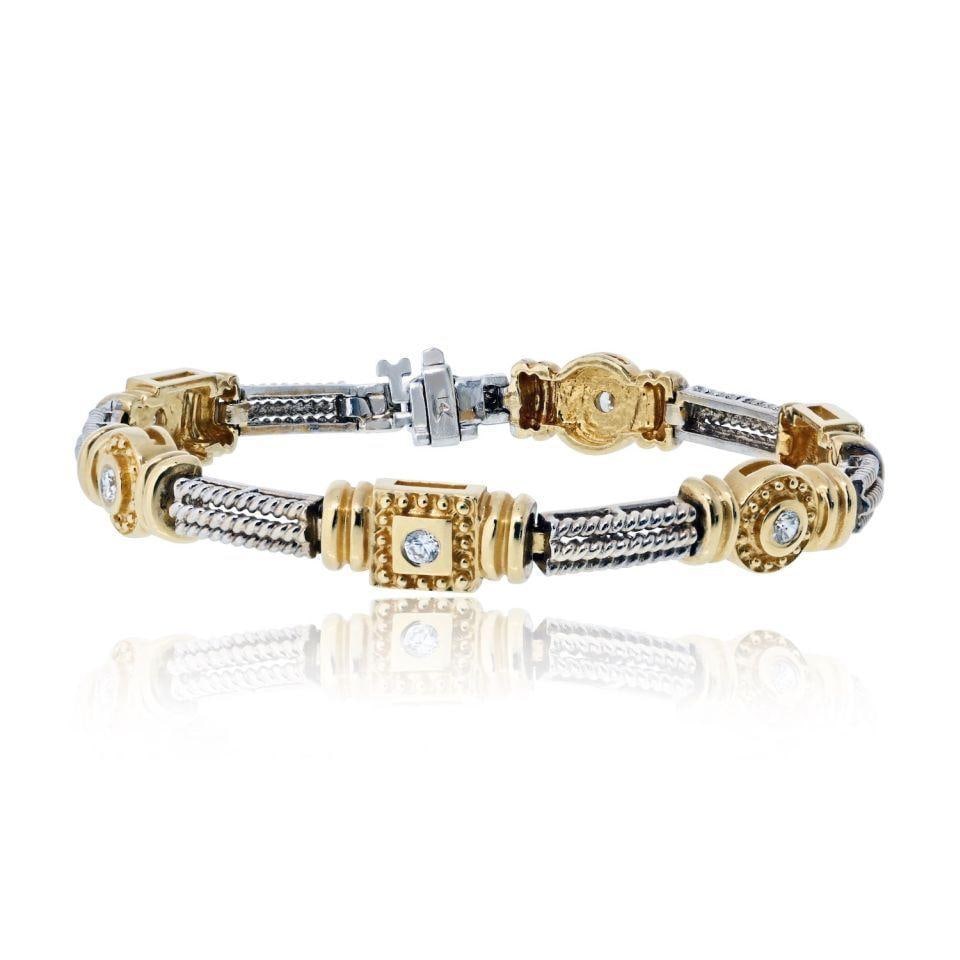 14K Yellow Gold Two Tone Diamond Bracelet 0.30 cttw 7 inches: 14K Yellow Gold Two Tone Diamond Bracelet 0.30 cttw 7 inches This pre-owned bracelet is crafted from 14K yellow gold with a two-tone design and features approximately 0.3 carats total weight of diamon