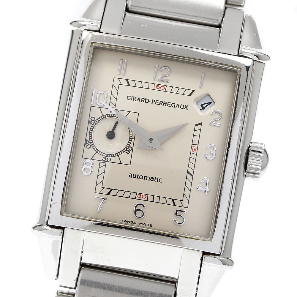 Girard Perregaux Vintage 1945 automatic date watch 25932 stainless steel: Girard Perregaux Vintage 1945 automatic date watch 25932 stainless steel This Girard Perregaux Vintage 1945 Date men's wristwatch features a stainless steel case and bracelet with a beige dial. The wa