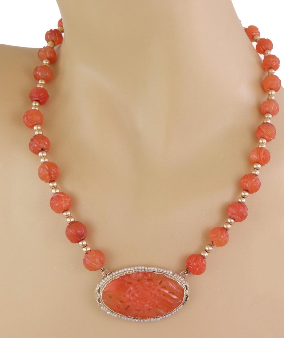 Vintage 14k Gold Carnelian Flower Seed Pearl Pendant Necklace: Vintage 14k Gold Carnelian Flower Seed Pearl Pendant Necklace This exquisite vintage necklace features a stunning oval pendant crafted from 14k yellow gold. The pendant showcases fine seed pearls enci