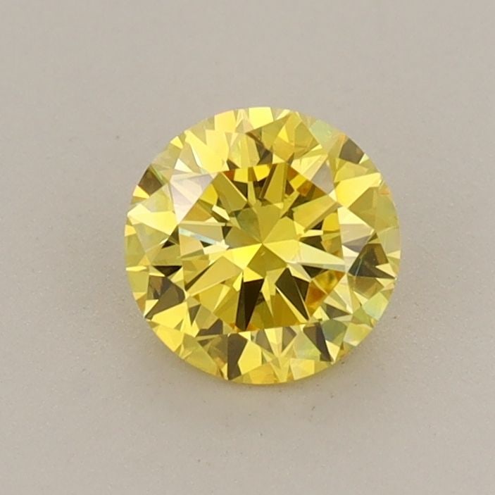 Loose Diamond - ROUND 0.59ct Fancy Vivid Yellow VS1: Loose Diamond - ROUND 0.59ct Fancy Vivid Yellow VS1 Source: This is a real non-mined Diamond that has been grown in a lab Shape: ROUND Carats: 0.59 Color: Fancy Vivid Yellow Certification: IGI Video: