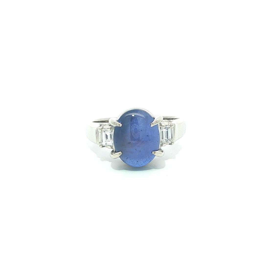 Platinum Star Sapphire Cocktail Ring with Diamond Sides Size 5.5: Platinum Star Sapphire Cocktail Ring with Diamond Sides Size 5.5 This elegant women's cocktail ring features a striking natural blue star sapphire as the centerpiece, cut in an oval cabochon style and