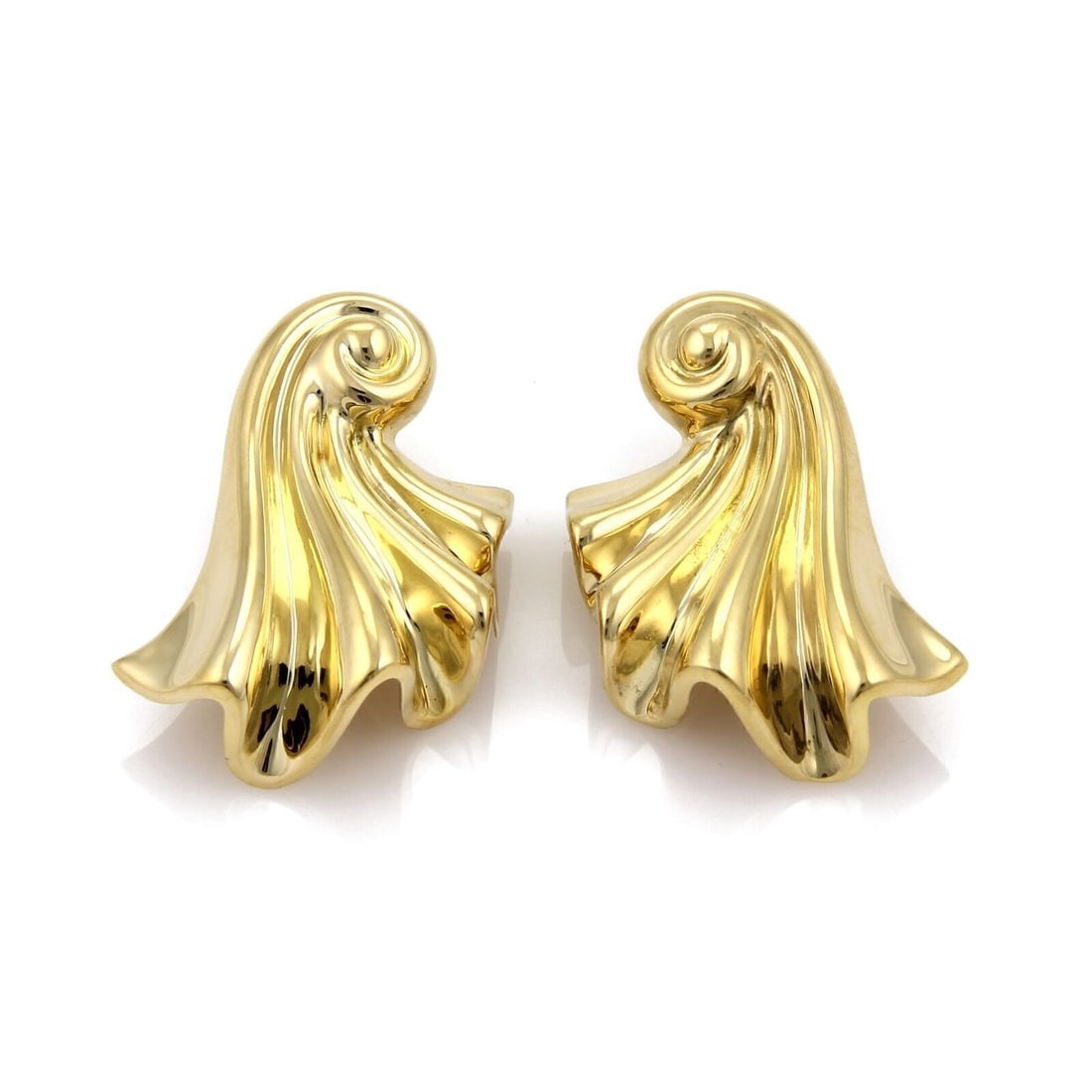 Vintage 18k Yellow Gold Shell Curl Huggie Earrings: Vintage 18k Yellow Gold Shell Curl Huggie Earrings These vintage huggie earrings are crafted from solid 18k yellow gold and feature bold, sculptural shell-curled silhouettes. The graceful dimensional 