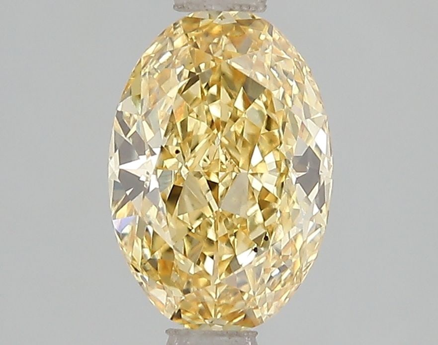 Loose Diamond - OVAL 1.59ct Fancy Vivid Yellow VS2: Loose Diamond - OVAL 1.59ct Fancy Vivid Yellow VS2 Source: This is a real non-mined Diamond that has been grown in a lab Shape: OVAL Carats: 1.59 Color: Fancy Vivid Yellow Certification: IGI Video: