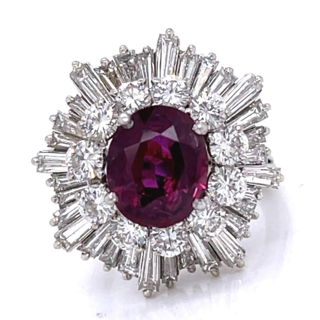 1960's 18K White Gold Ruby 3.75 Ct Diamond Ring 43 Diamonds F-G VVS-VS: 1960's 18K White Gold Ruby 3.75 Ct Diamond Ring 43 Diamonds F-G VVS-VS This stunning 1960's ring is crafted from 18K white gold and features a captivating central ruby weighing approximately 3.75 Ct. 