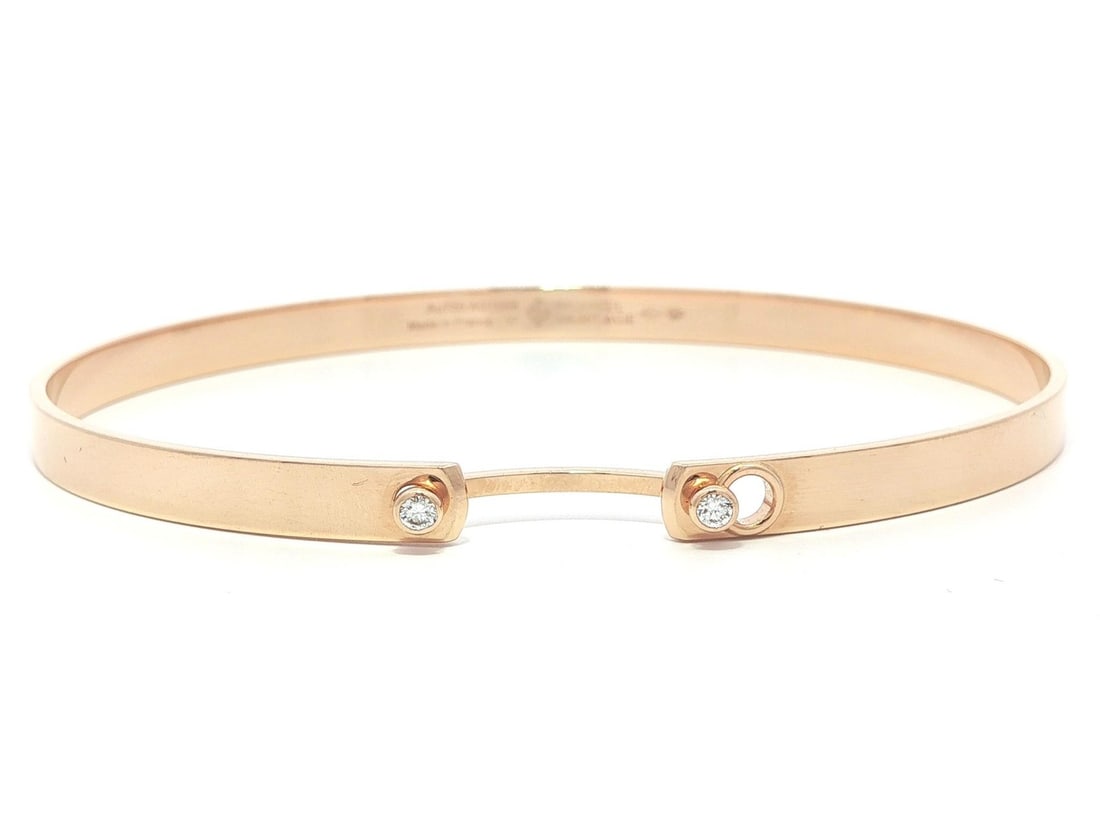 Monday Morning Mood Bangle 18k Rose Gold with Diamonds by Nouvel Heritage: Monday Morning Mood Bangle 18k Rose Gold with Diamonds by Nouvel Heritage This elegant bangle bracelet is crafted from solid 18k rose gold and features two natural round brilliant cut diamonds with a 