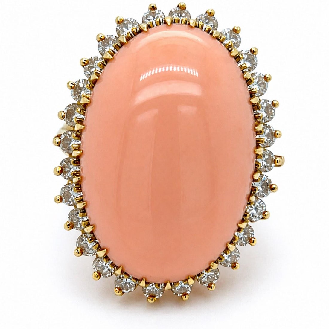 18K Gold Ring with Coral Center and 28 Diamonds Circa 1960s: 18K Gold Ring with Coral Center and 28 Diamonds Circa 1960s This 1960s ring features a vibrant coral centerpiece set in 18K yellow gold, accented by 28 diamonds with a total approximate weight of 1.25