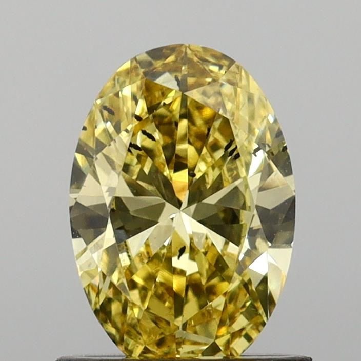 Loose Diamond - OVAL 0.86ct Fancy Vivid Yellow SI1: Loose Diamond - OVAL 0.86ct Fancy Vivid Yellow SI1 Source: This is a real non-mined Diamond that has been grown in a lab Shape: OVAL Carats: 0.86 Color: Fancy Vivid Yellow Certification: IGI Video: