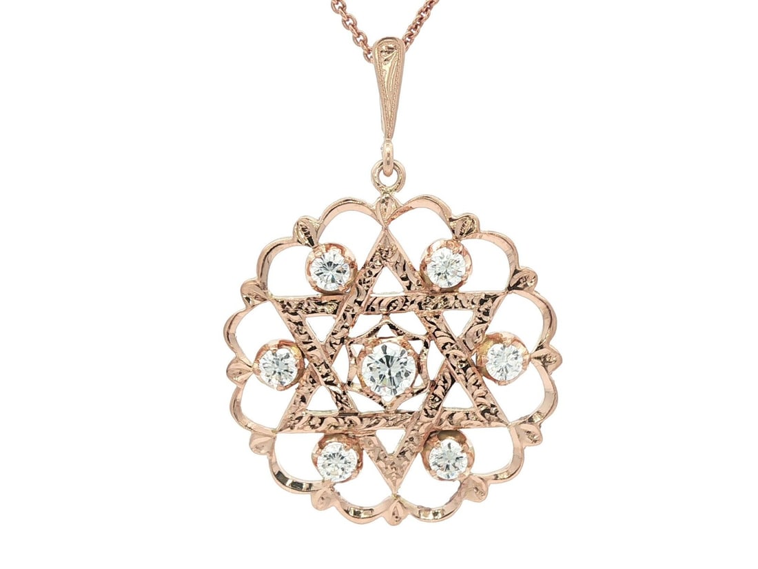 Vintage 14k Rosy Yellow Gold Diamond Star of David Pendant 1.53ctw: Vintage 14k Rosy Yellow Gold Diamond Star of David Pendant 1.53ctw This stunning Vintage 14k Rosy Yellow Gold Diamond Star of David Medallion Pendant features a captivating design that beautifully com