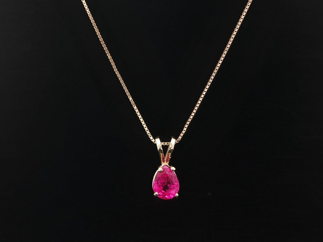 Pear Shaped Burma No Heat Ruby Pendant in 14k Yellow Gold with GIA Report: Pear Shaped Burma No Heat Ruby Pendant in 14k Yellow Gold with GIA Report This vintage pendant necklace features a natural, untreated Burma ruby in a pear cut, weighing 0.93 carats and certified by GI