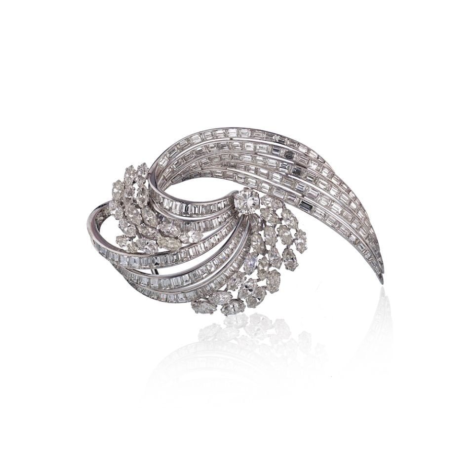 1960s Platinum Diamond Floral Brooch 35cts Vintage Elegance: 1960s Platinum Diamond Floral Brooch 35cts Vintage Elegance This exquisite circa 1960s brooch showcases a stunning floral motif crafted in solid platinum. The design features marquise diamonds that el